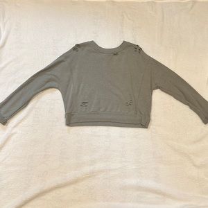 Cropped, long sleeve ripped shirt